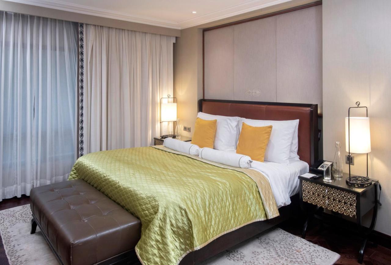 Hotel The Claridges Nowe Delhi Zewnętrze zdjęcie A bedroom at the Taj Bengal
